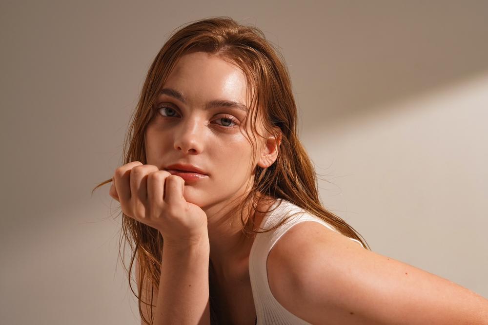 Model showcasing radiant skin and natural beauty at The Infinity Glow in Placentia, CA