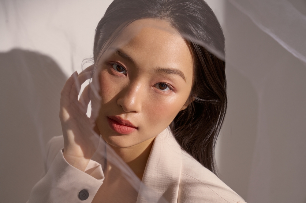 Woman with glowing skin representing advanced facial aesthetics at The Infinity Glow